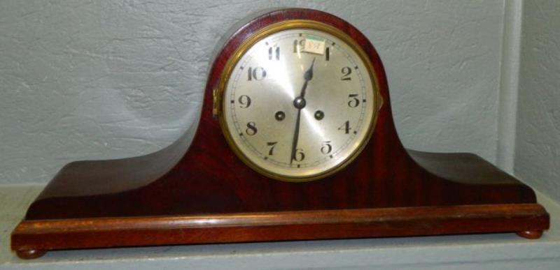 Mahogany German chiming clock. 21″ x 9 1/2″.