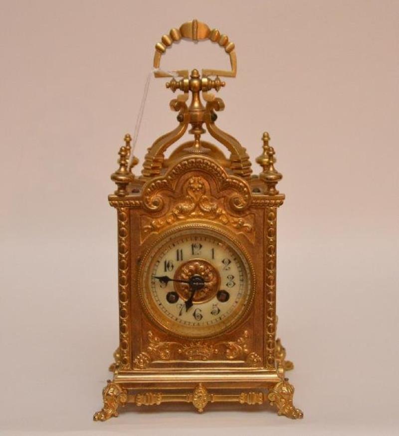 Gilt Bronze Carriage Clock with swing handle.  Raised