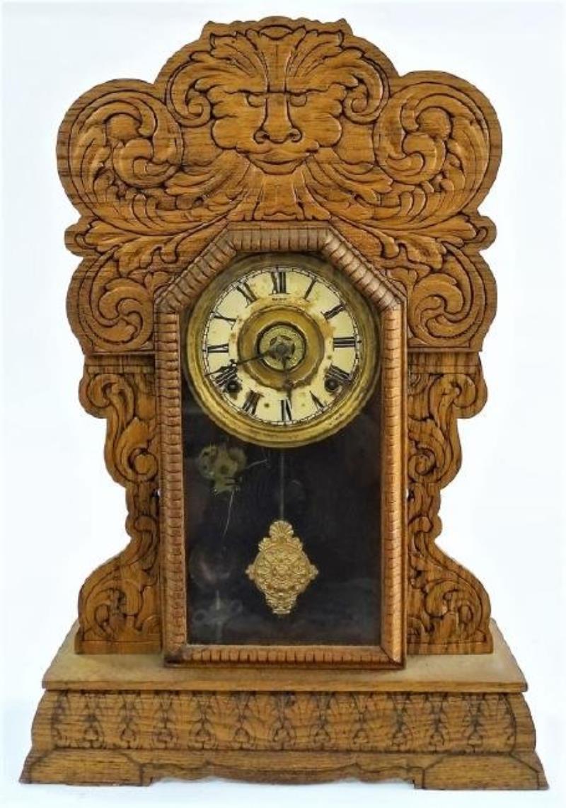 Early 20th century American pressed Oak case gingerbread clock