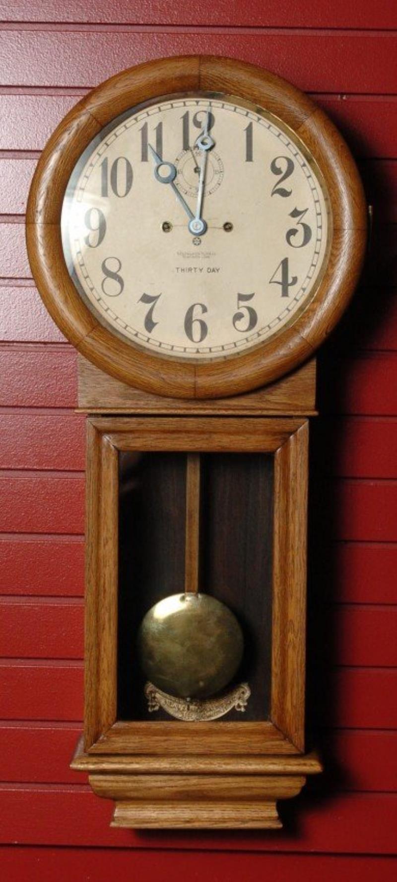 A NEW HAVEN ‘SATURN’ WALL CLOCK IN OAK CASE