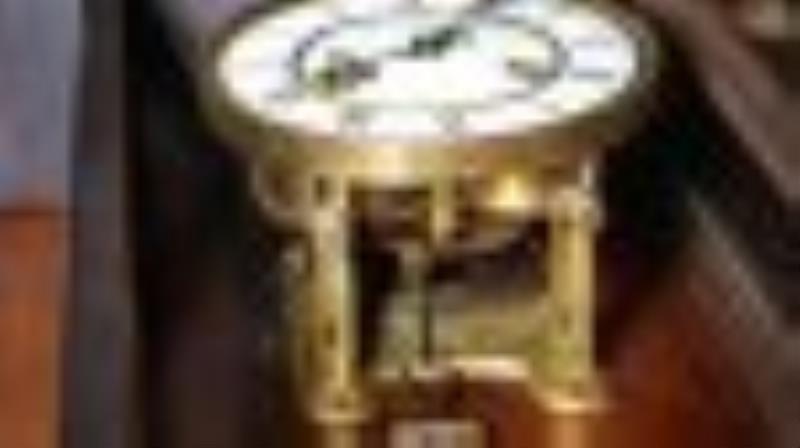 Walnut Vienna wall clock by Junghans, 38 in. T, 13 in.