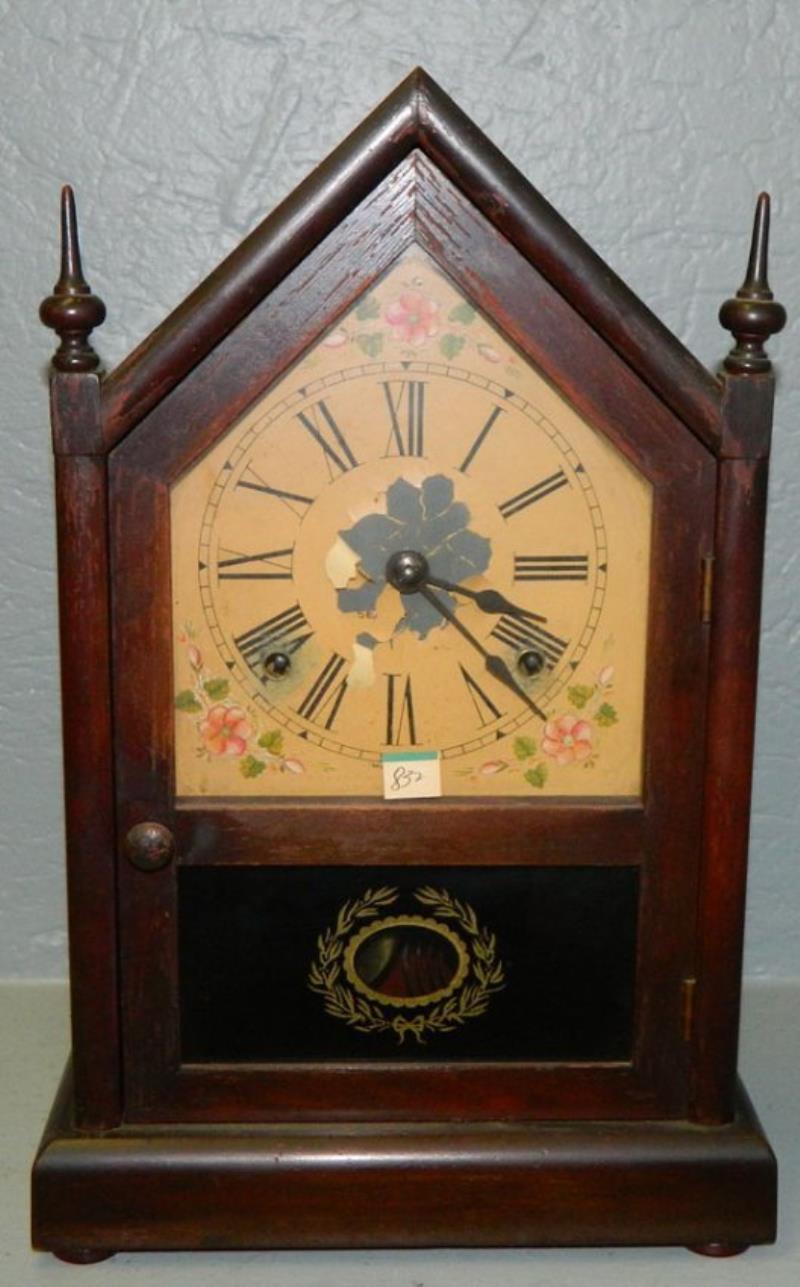 8 day Seth Thomas steeple clock w/ floral detail.