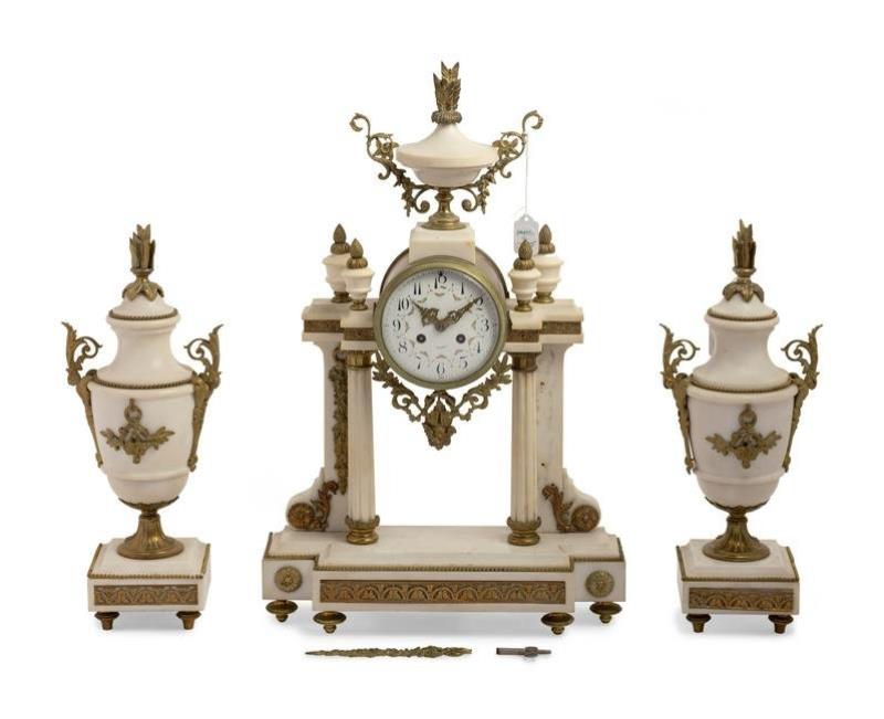 A French Gilt Metal Mounted Marble Three-Piece Clock