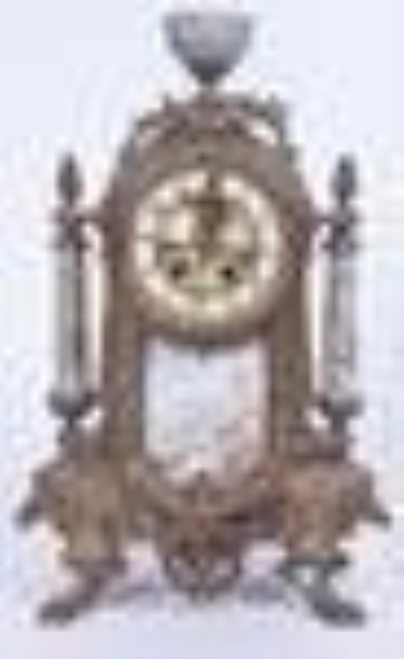 Patinated white metal French mantel clock