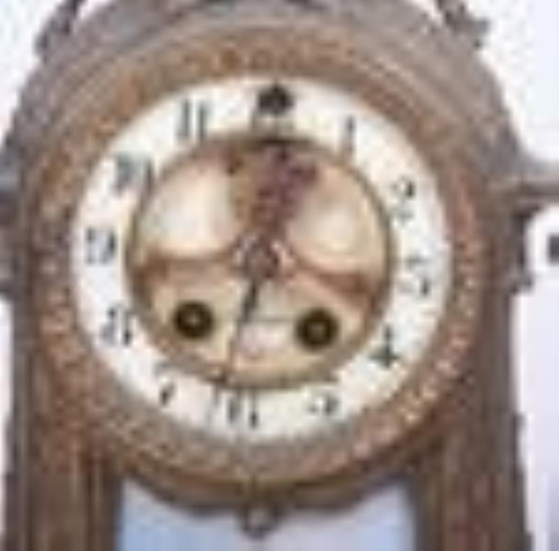 Patinated white metal French mantel clock
