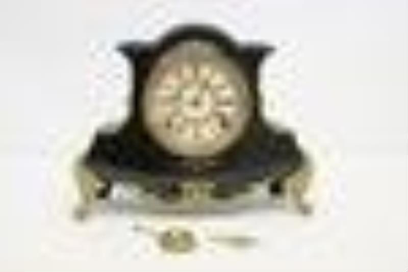 A cast case 8-day Ansonia clock