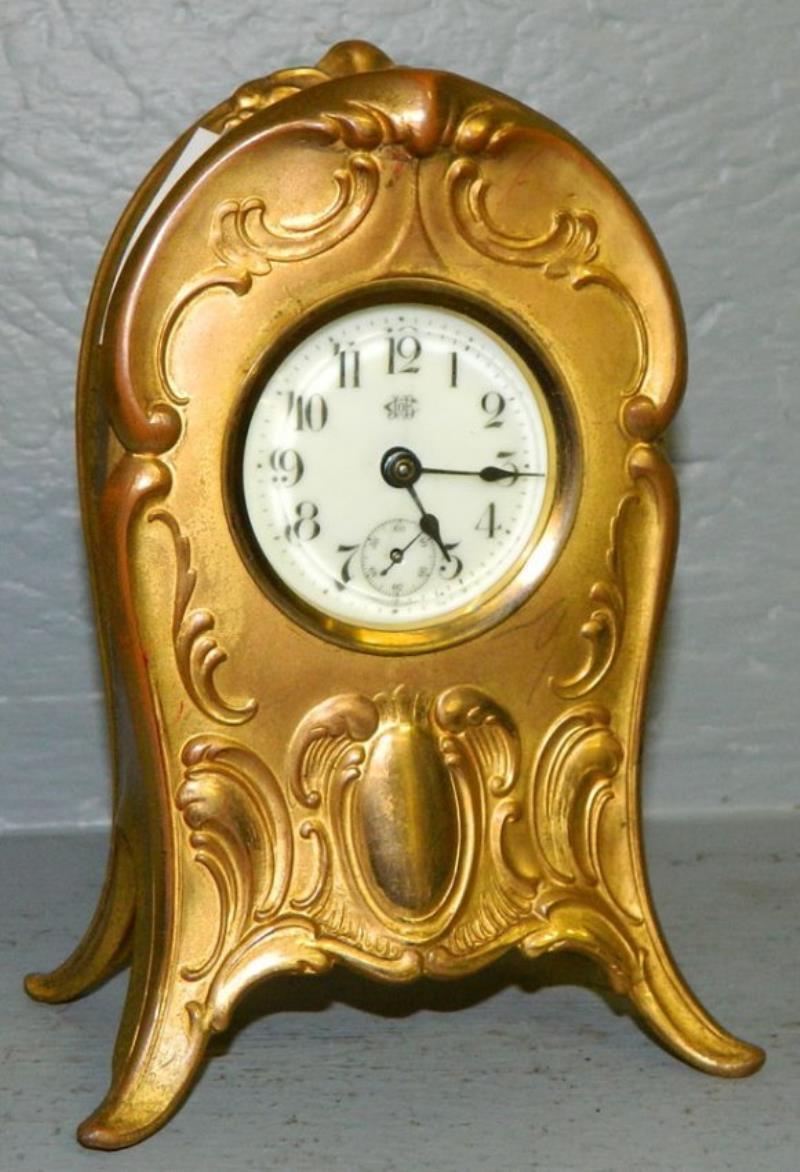 Jennings Brothers gilded cast metal case clock.