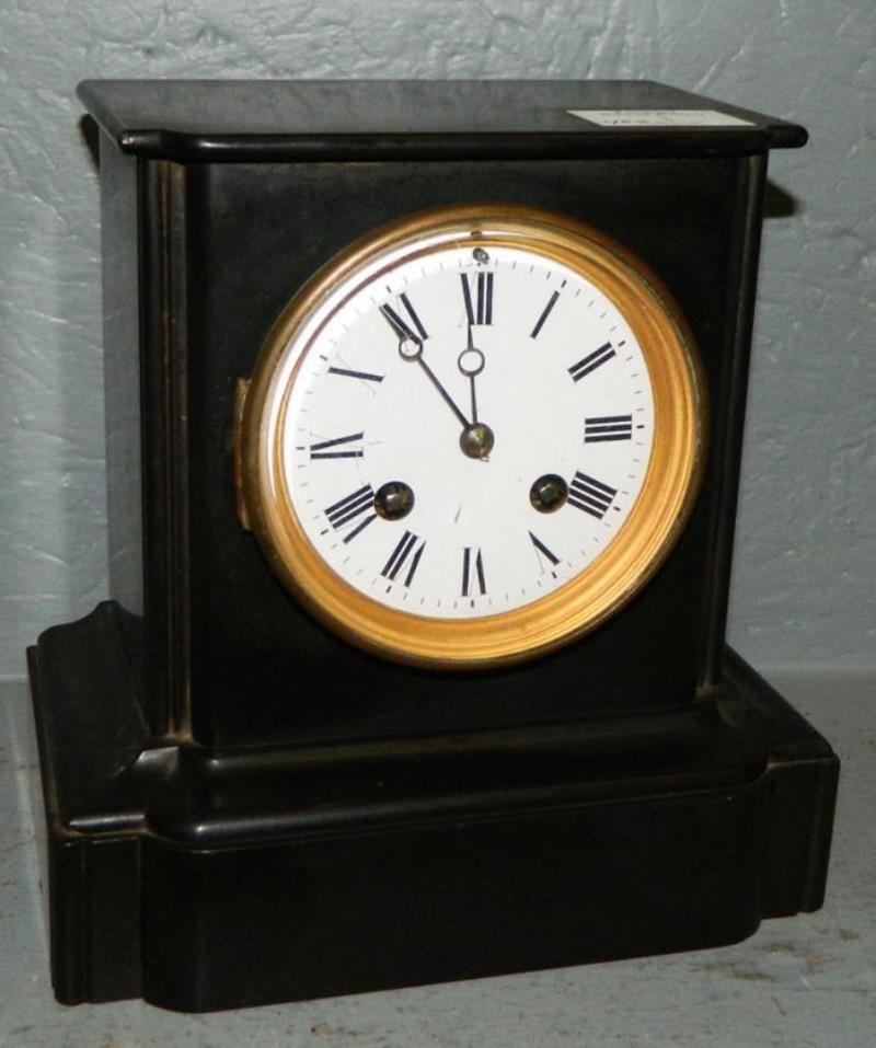 Eight day black marble French shelf clock.