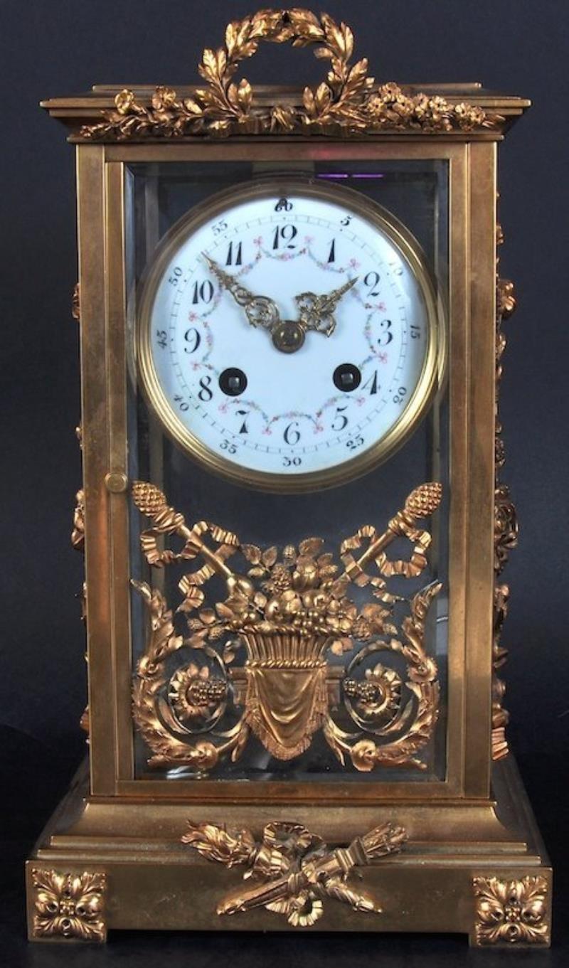 A 19TH CENTURY FRENCH BRASS FOUR GLASS CLOCK, with