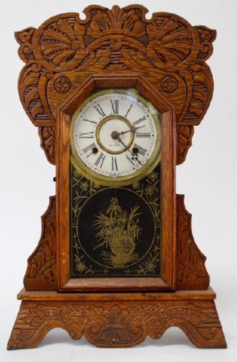 Late 19th century pressed Oak case gingerbread clock by New Haven Clock Co