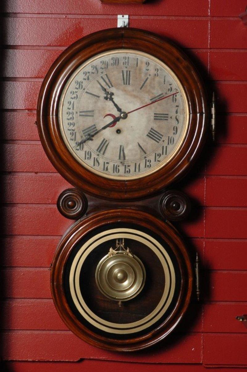 AN INGRAHAM ‘REFLECTOR’ IONIC FIGURE EIGHT WALL CLOCK