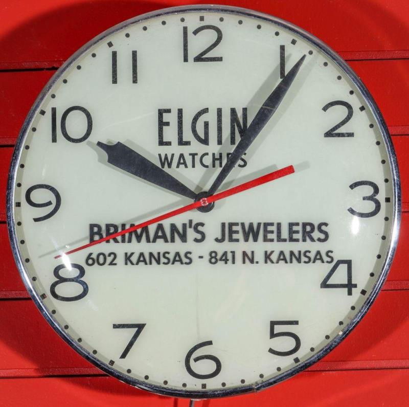 A LIGHTED ELECTRIC CLOCK ADVERTISING ELGIN WATCHES