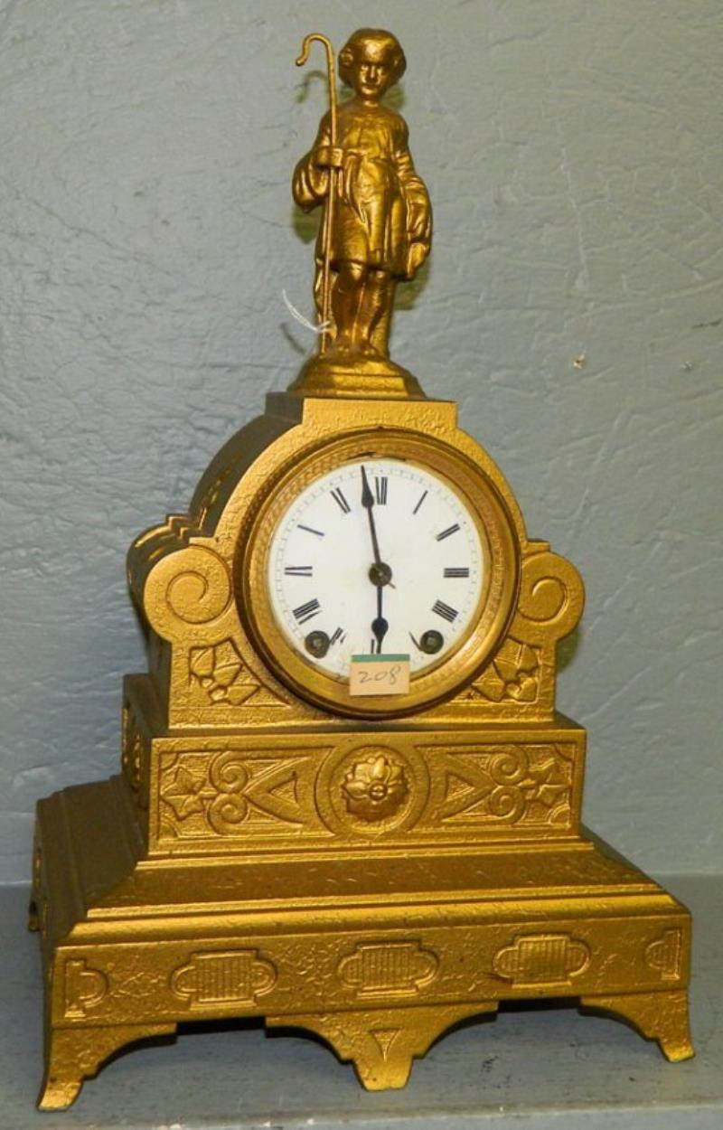 Seth Thomas gold painted figural mantle clock.