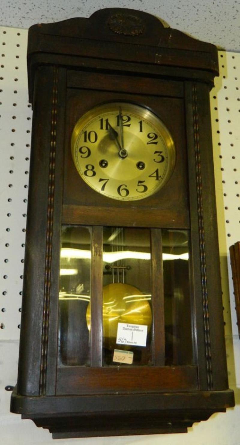 German wall clock with silver painted dial.