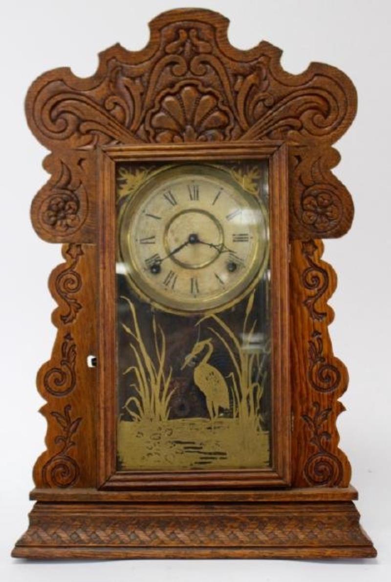 Late 19th to Early 20th century American pressed Oak case gingerbread clock