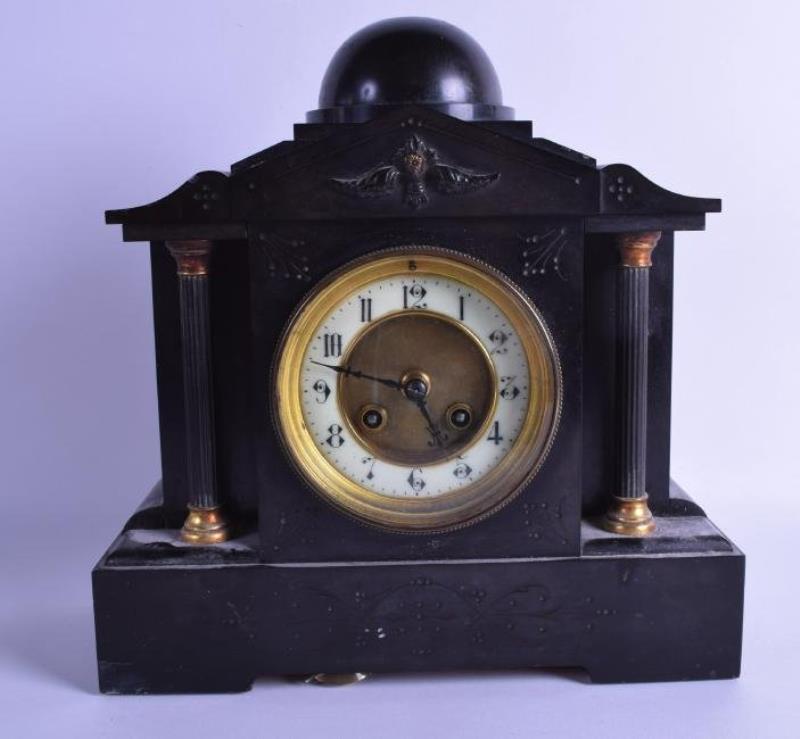 A VICTORIAN BLACK SLATE MANTEL CLOCK decorated with a