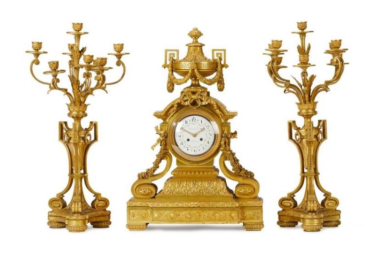 A French Louis XV-style clock and garniture set