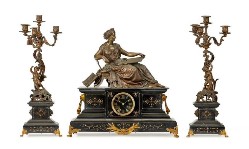 A Victorian-style mantel clock and garniture set