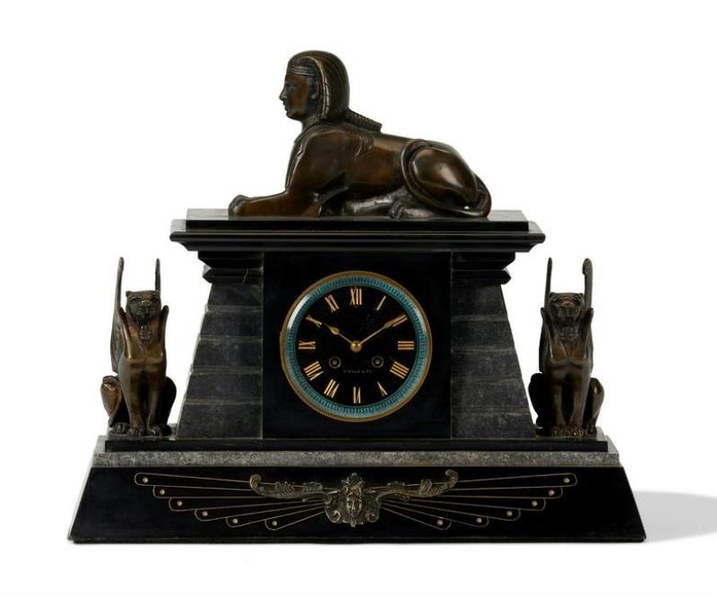 An Egyptian Revival bronze and marble mantel clock