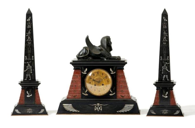 A Victorian Egyptian Revival clock and garniture set