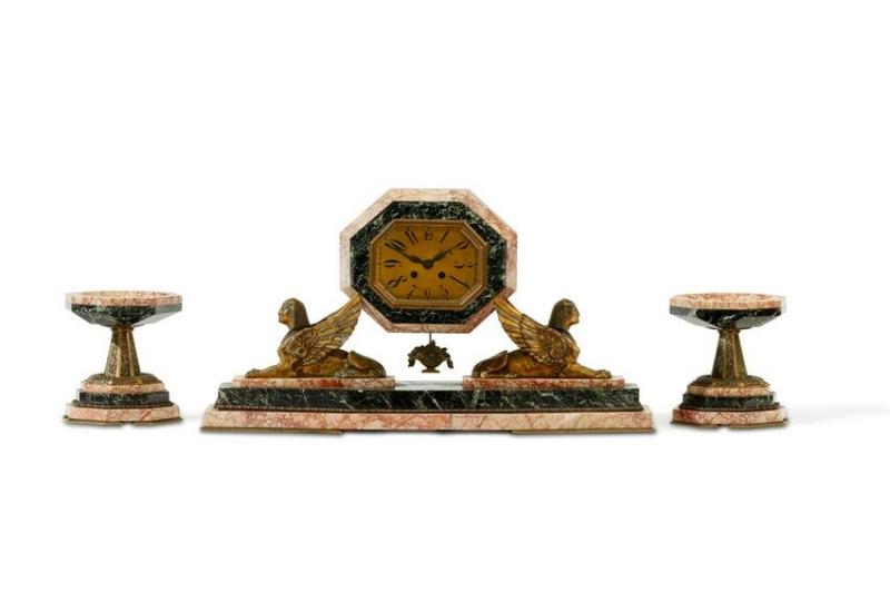 An Egyptian Revival clock and garniture set