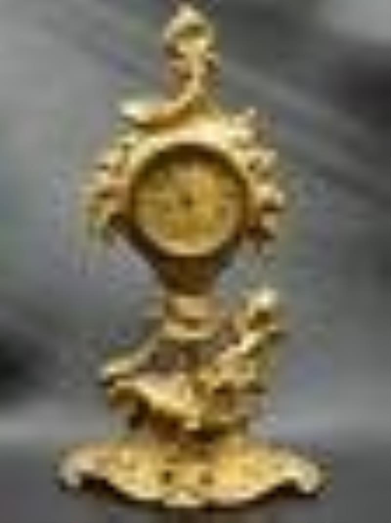 Vintage Art Nouveau clock with cherub. Cherub and flowers