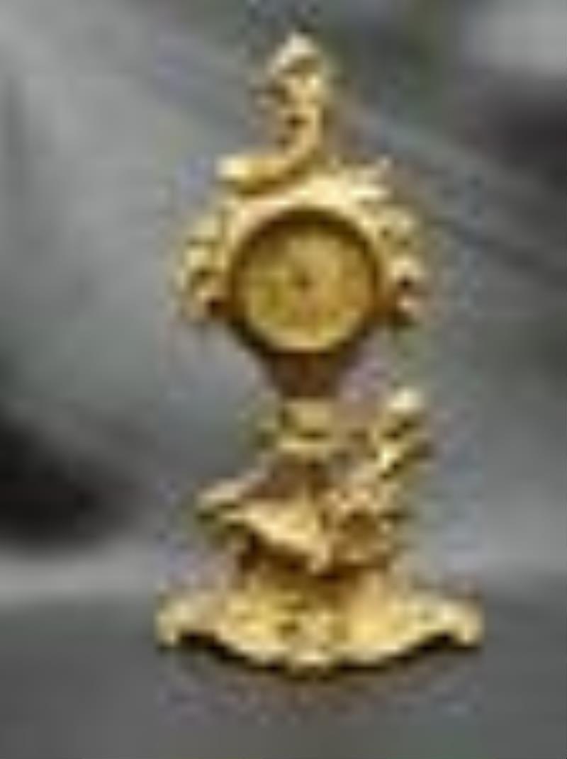 Vintage Art Nouveau clock with cherub. Cherub and flowers