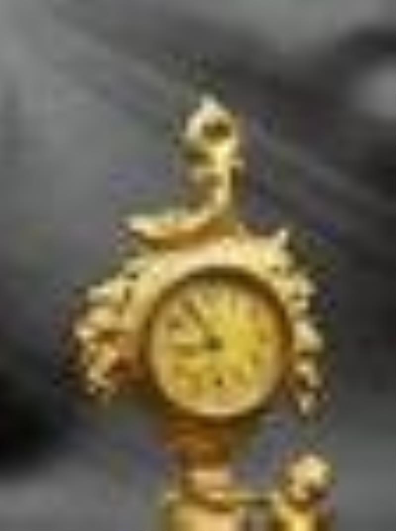 Vintage Art Nouveau clock with cherub. Cherub and flowers