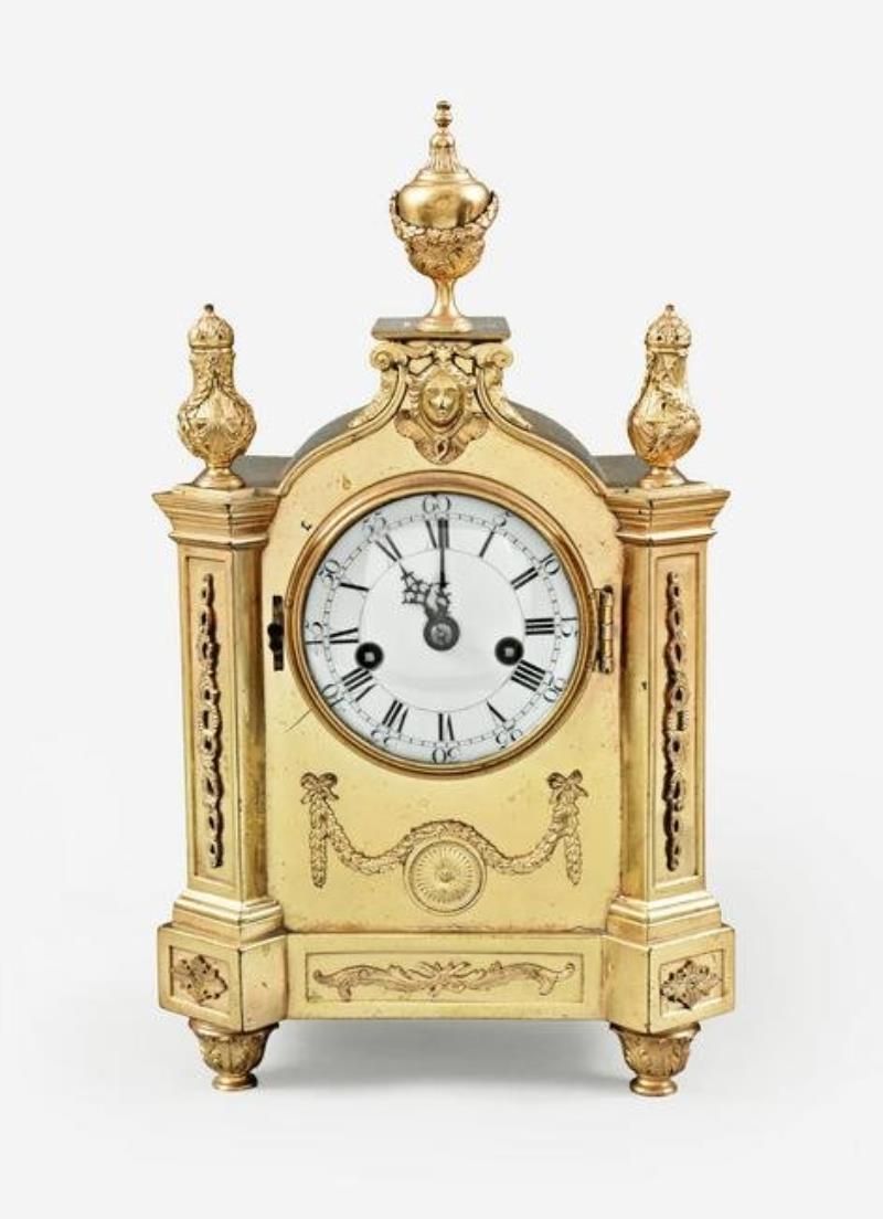 An unusual small gilt bronze mantel clock by Ellicott