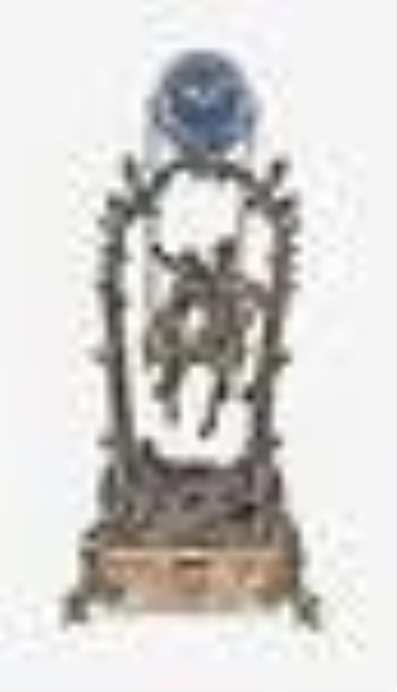 A turn of the 20th century couple on a swing figural mystery clock