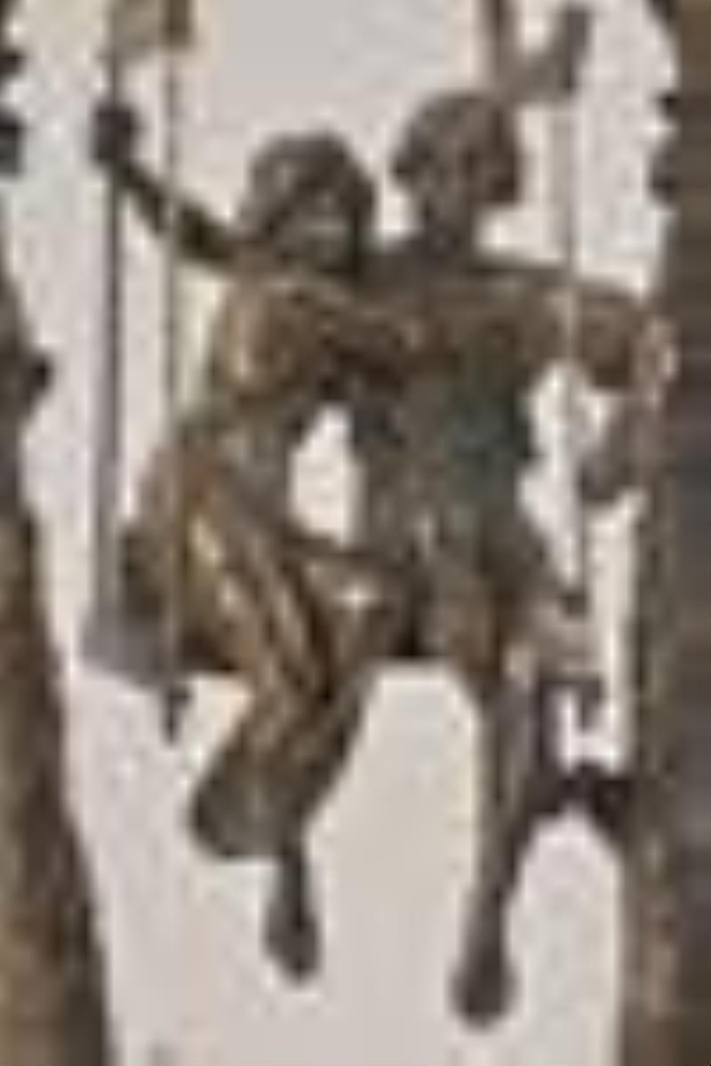 A turn of the 20th century couple on a swing figural mystery clock