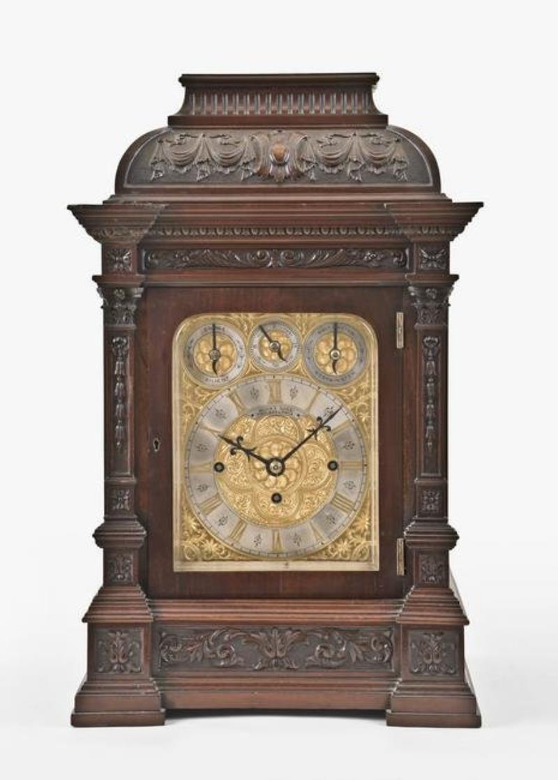 A large mahogany bracket clock chiming on gongs and bells by Elliott