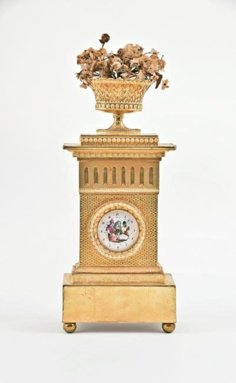 A rare early 19th century gilt card stock and Dresden trim clock