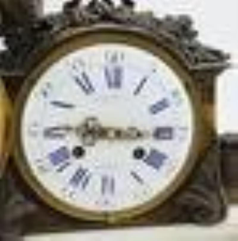 Charpentier and Co. Gilt and Patinated Bronze Mounted Mantel Clock