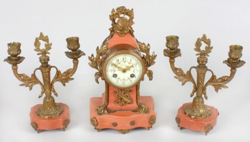 A late 19th century French three piece clock garni