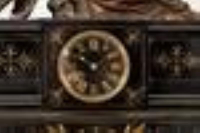 A Victorian-style mantel clock and garniture set