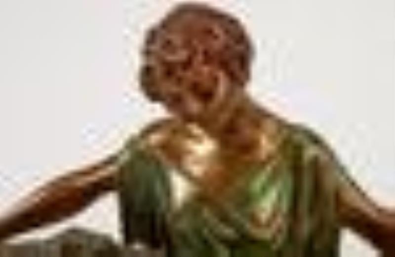 An Art Deco French figural mantel clock