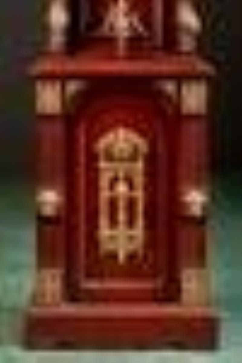 An Ansonia tall case clock