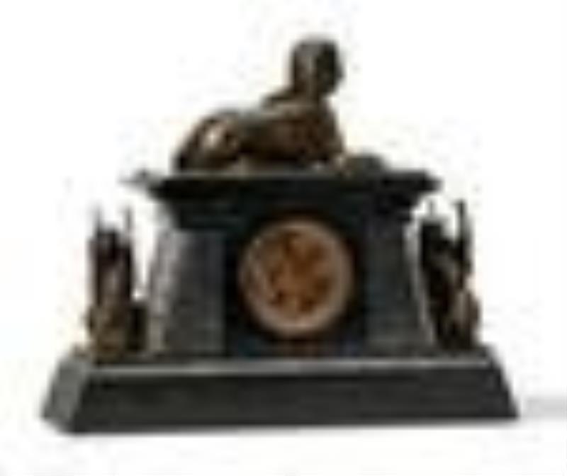 An Egyptian Revival bronze and marble mantel clock