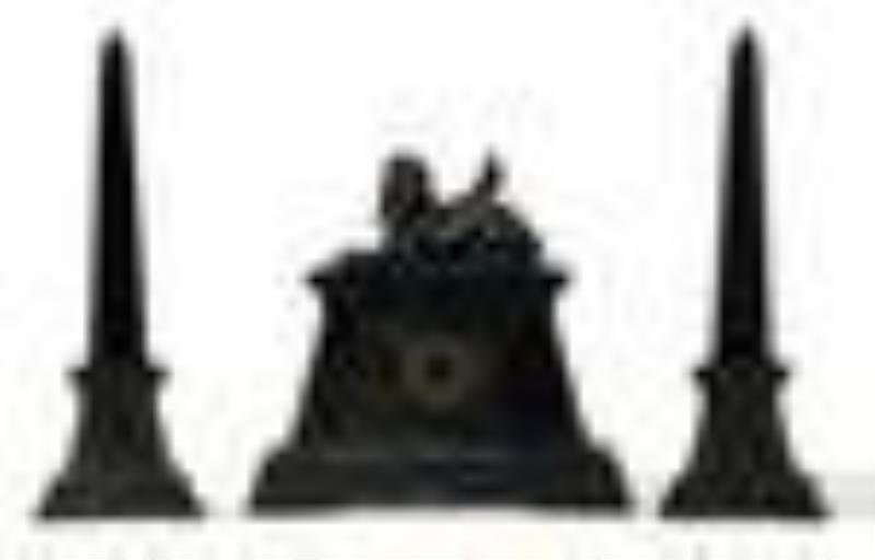 A Victorian Egyptian Revival clock and garniture set