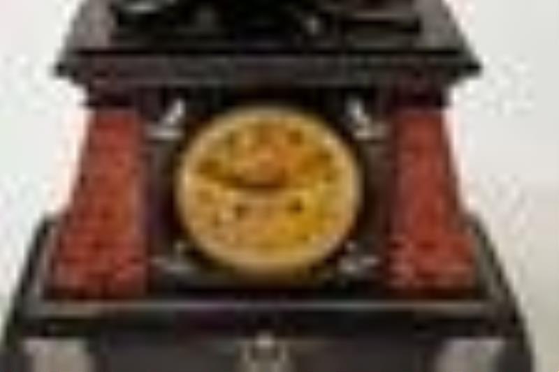 A Victorian Egyptian Revival clock and garniture set
