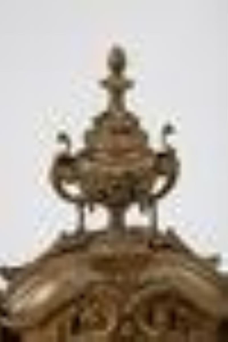 A French bronze mantel clock and candelabra