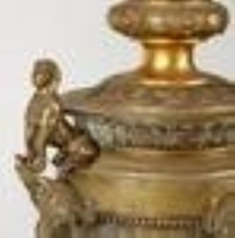 A Greco-Roman Revival clock and garniture set