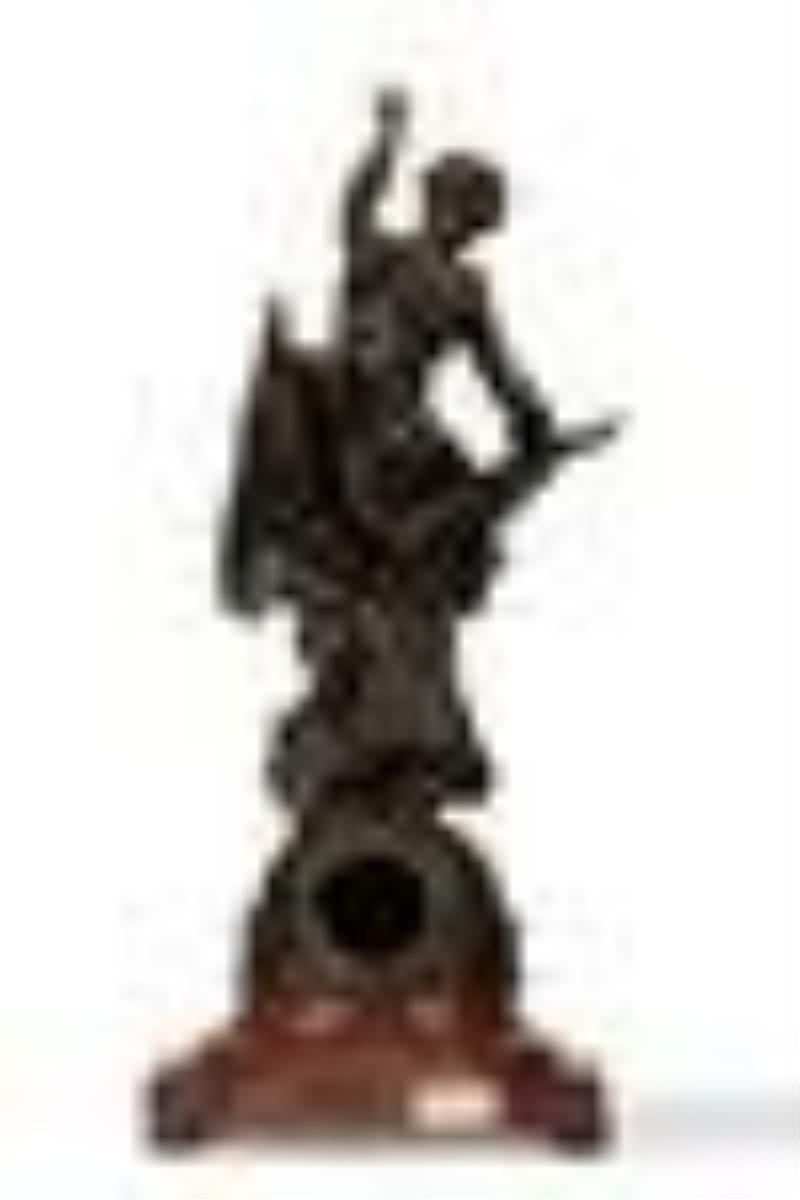 A French bronze and rouge marble figural clock
