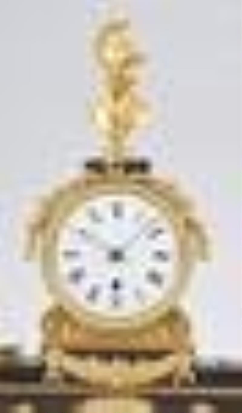 An English gilt and patinated bronze mantel clock signed Baetens London
