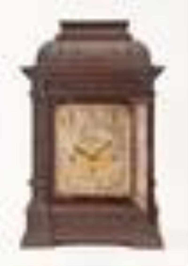A large mahogany bracket clock chiming on gongs and bells by Elliott