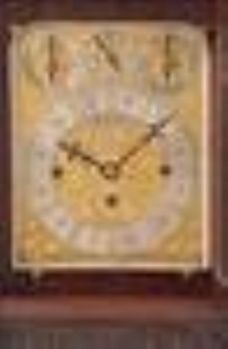 A large mahogany bracket clock chiming on gongs and bells by Elliott