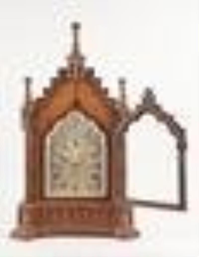 A late 19th century English Gothic style bracket clock chiming on eight bells