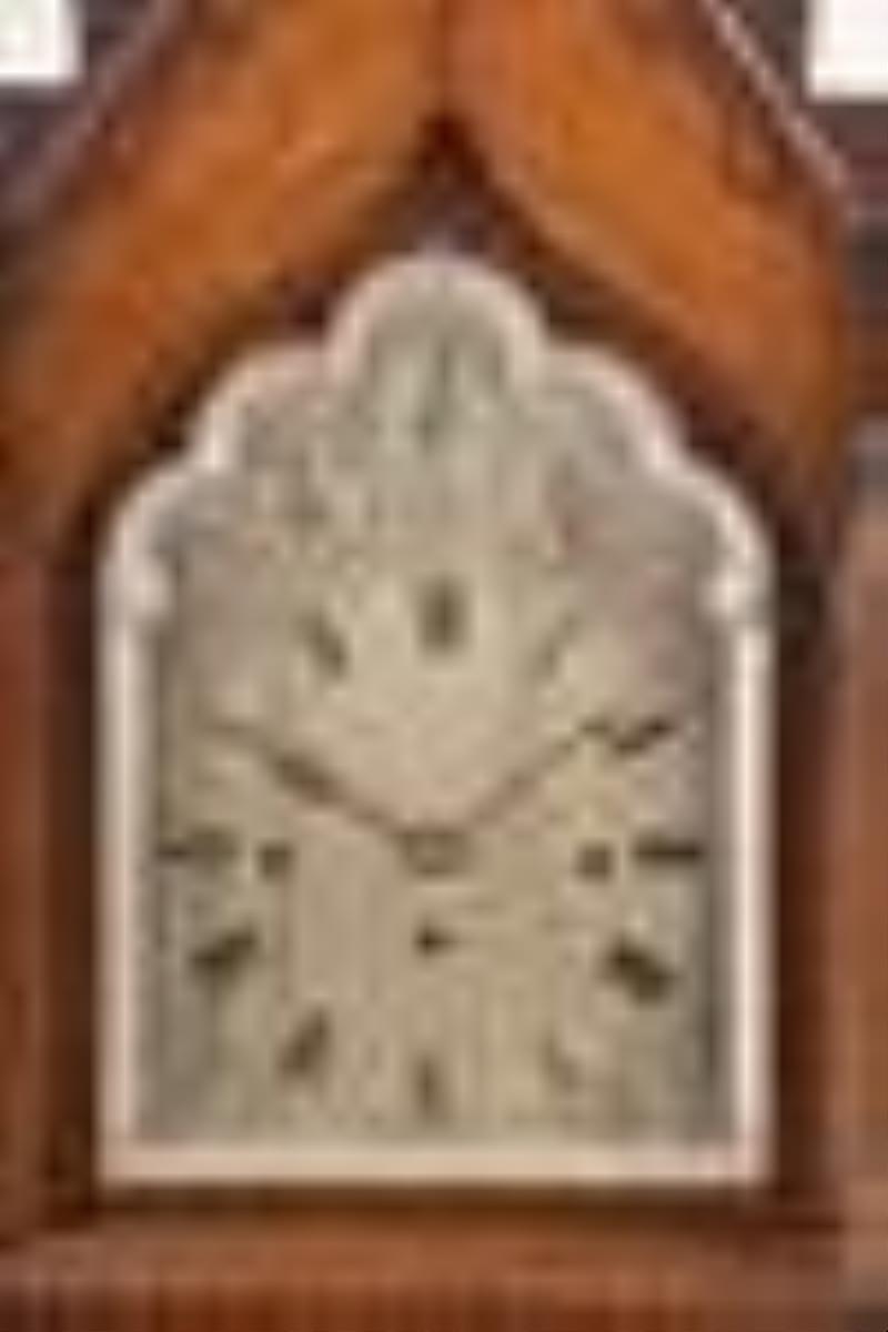 A late 19th century English Gothic style bracket clock chiming on eight bells