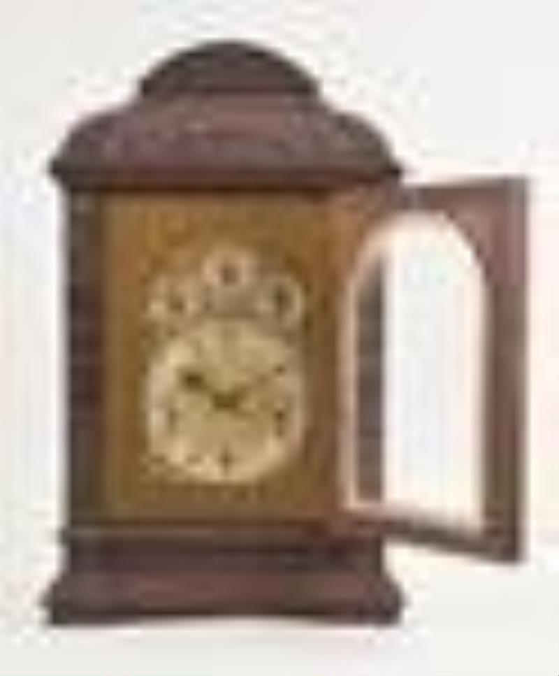 An unusual carved oak chiming bracket clock for the English market by Winterhalder & Hofmeier